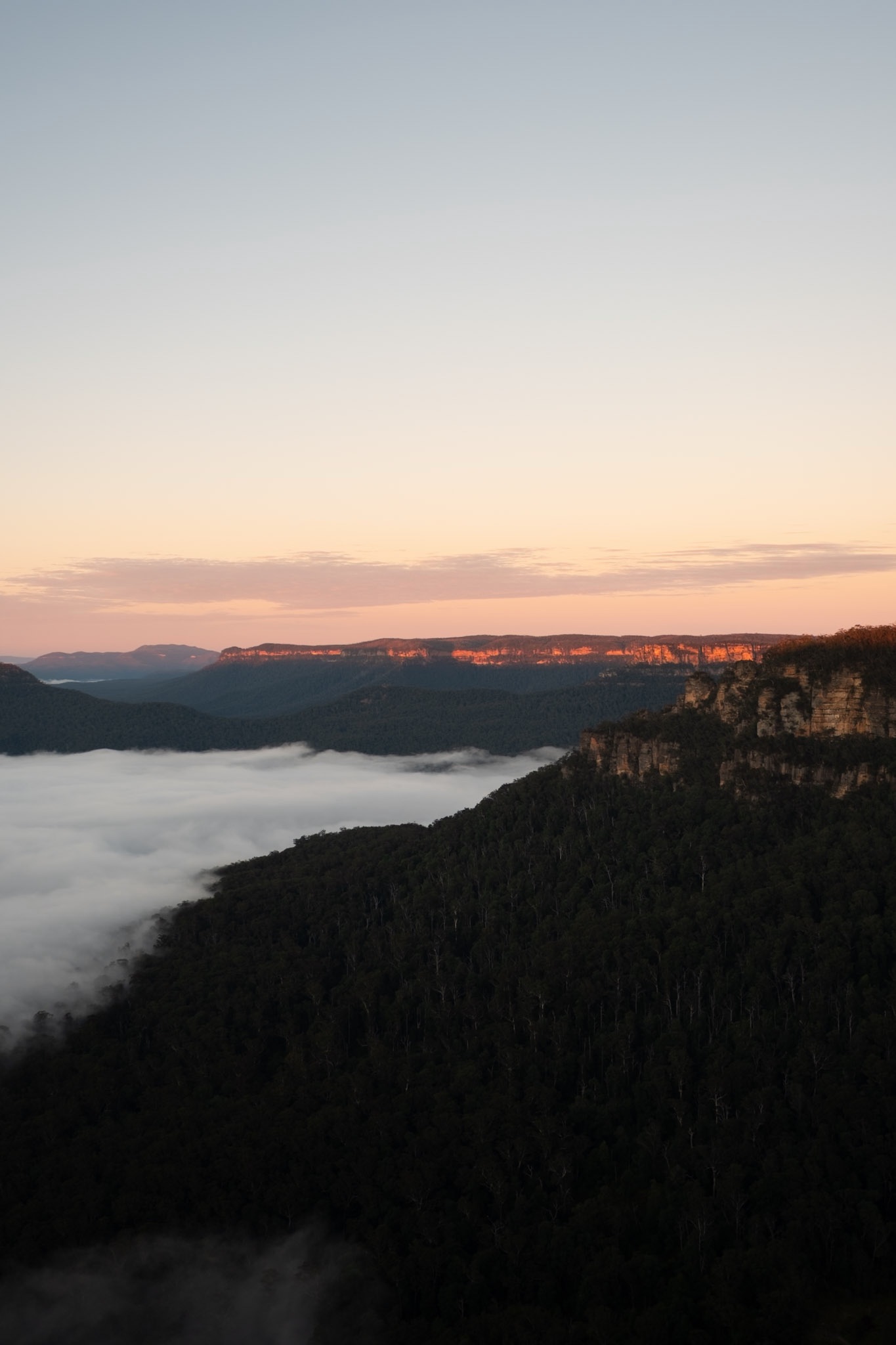 Ridgelines floating above a sea of cloud at dawn